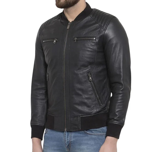 Men's black leather jacket with zippered pockets and ribbed cuffs, styled with jeans