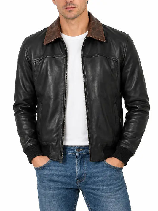 Front view of men's black leather jacket unzipped, showing brown collar and white tee underneath