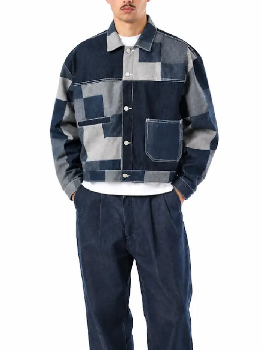 Man wearing patchwork denim cropped jacket, front view, hands in pockets