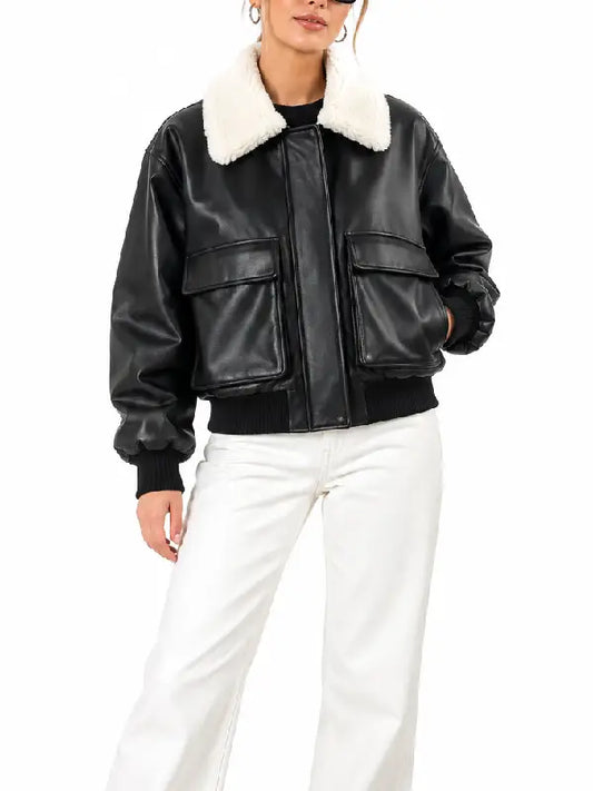 Women's black cropped leather bomber jacket with flap pockets styled with white jeans