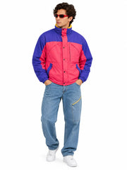 Men's retro purple and pink 90s color-block puffer jacket styled with light-wash jeans on a male model