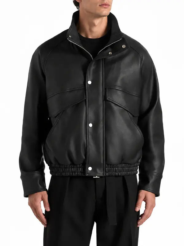 Men's black real leather funnel neck bomber jacket with snap-button front, oversized flap pockets and elasticated waistband.