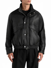 Men's black real leather funnel neck bomber jacket with snap-button front, oversized flap pockets and elasticated waistband.