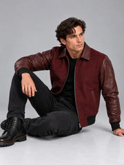 Men's burgundy wool and leather varsity bomber jacket with leather sleeves