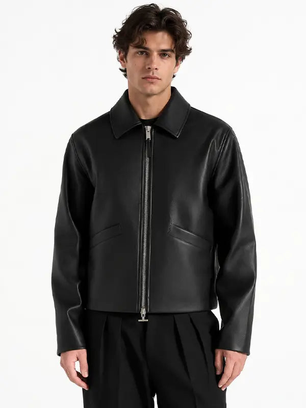 Men's minimalist black real leather jacket featuring a pointed collar, full-length silver zipper and discreet angled welt pockets.
