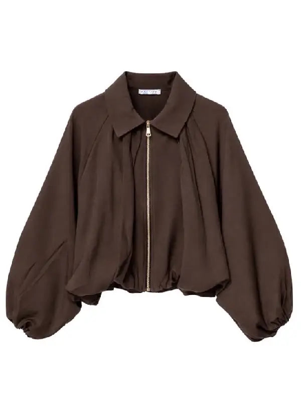 Brown cropped jacket with balloon sleeves and gold zipper, front view