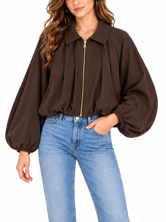Brown cropped jacket with balloon sleeves and gold zipper, front view