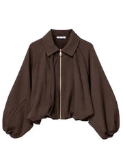Brown cropped jacket with balloon sleeves and gold zipper, front view