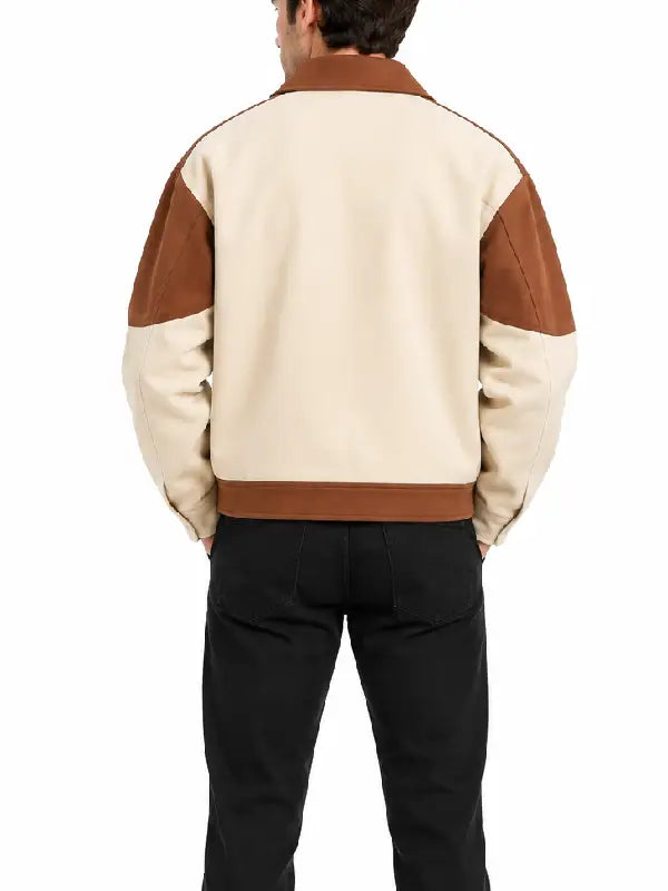 Back view of a men's cream and brown colorblock jacket with tan shoulder panels and contrast hem