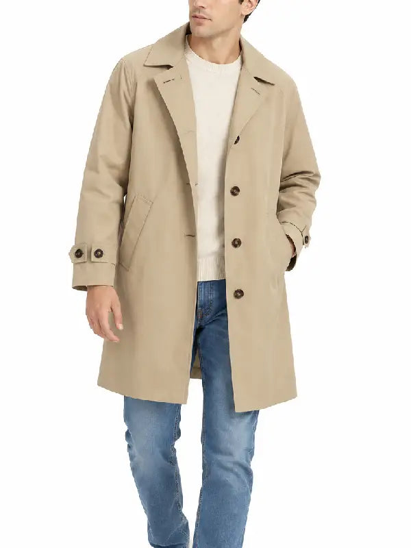 Man wearing a beige mid-length car coat with point collar, button front, and side pockets