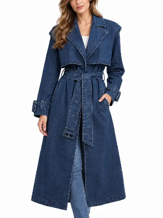 Front view of women's blue denim trench coat with notched collar, button closure, and belted cuffs