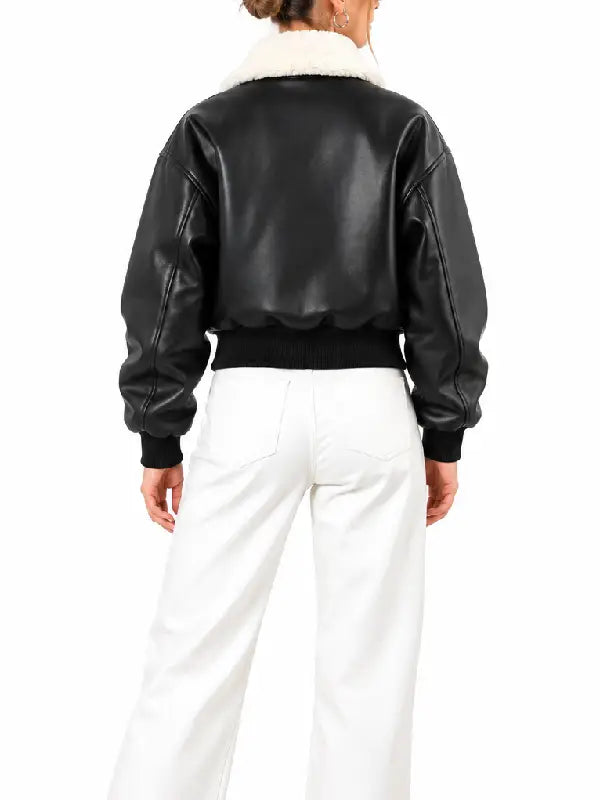 Back view of women's black leather bomber jacket with white shearling collar