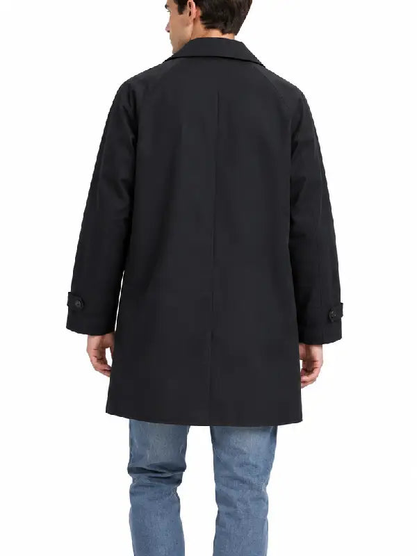 Back view of a men's black car coat showing raglan sleeves and button tab cuffs