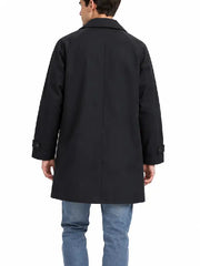 Back view of a men's black car coat showing raglan sleeves and button tab cuffs