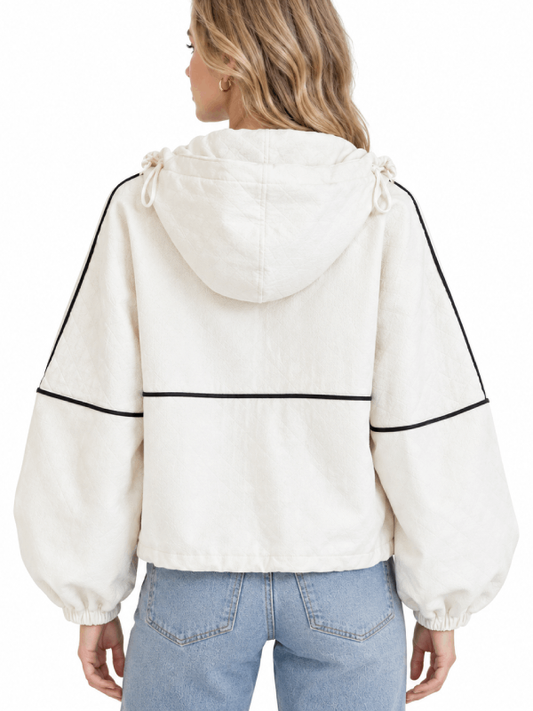 Back view of a women's cream hooded jacket with black contrast piping and balloon sleeves with elastic cuffs