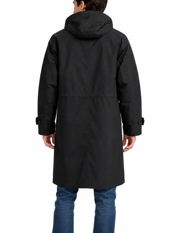 Back view of man wearing black long hooded trench coat with jeans