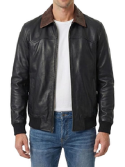 Front view of men's black leather jacket unzipped, showing brown collar and white tee underneath