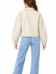 Back view of women’s cream cropped utility jacket with snap button cuffs and relaxed fit