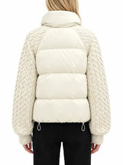 Back view of women's cream puffer jacket with cable-knit raglan sleeves and drawcord hem