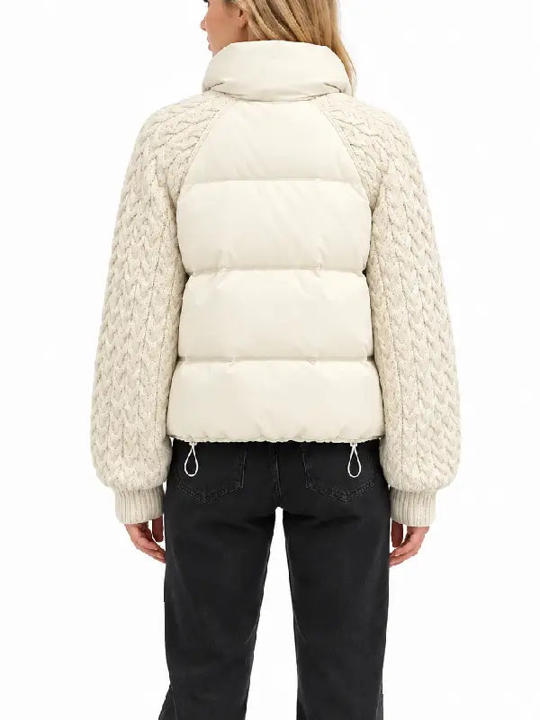 Back view of women's cream puffer jacket with cable-knit raglan sleeves and drawcord hem