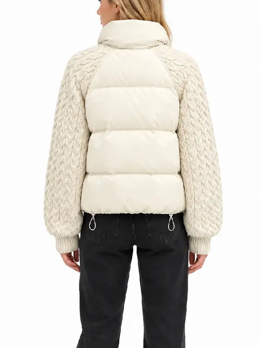 Back view of women's cream puffer jacket with cable-knit raglan sleeves and drawcord hem