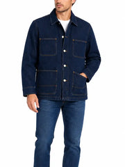 Man wearing dark denim chore jacket, front view with four-pocket design and snap closure