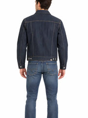 Back view of man wearing dark rinse wash denim trucker jacket with jeans and white sneakers