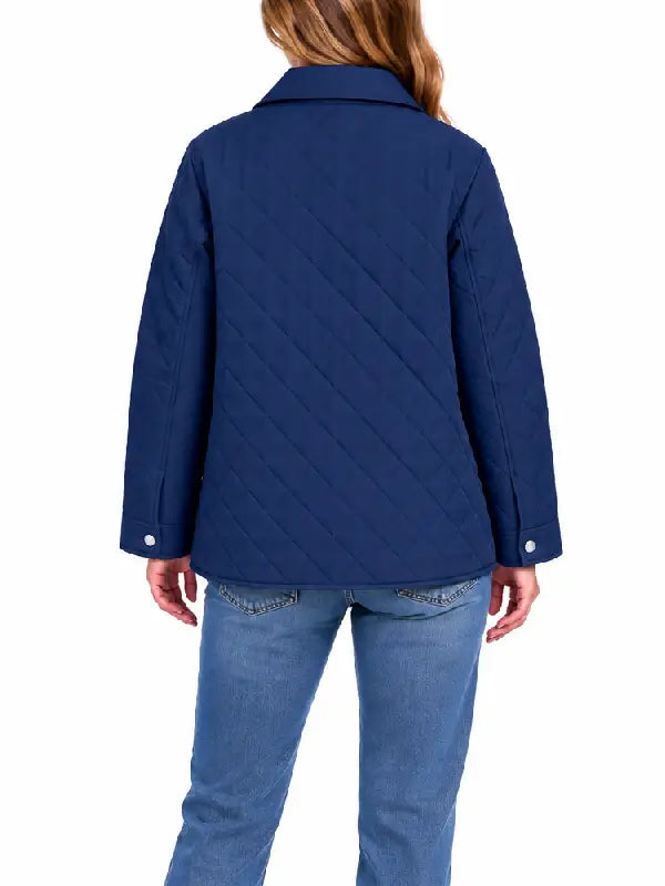 Woman wearing navy diamond quilted shirt jacket, back view