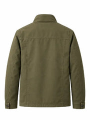 Back view of men's olive green cotton twill field jacket with yoke seam and button cuffs