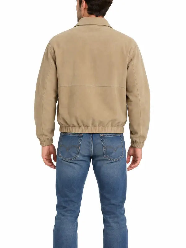 Back view of man wearing khaki suede zip-up jacket with jeans