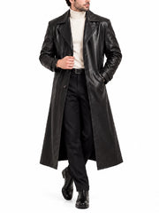 Full front view of men’s long black leather trench coat styled with turtleneck and trousers