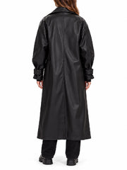 Back view of women’s long black leather trench coat with raglan sleeves and strap cuffs