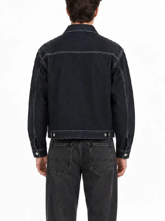 Back view of a men's dark denim jacket with contrast stitching, yoke seam, and button waist adjusters