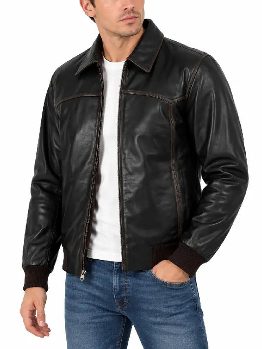 Side angle view of men's black leather jacket showing fit and distressed stitching