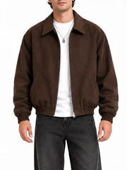 Close-up of men’s brown faux suede bomber jacket showing shirt collar, zipper and ribbed cuffs and hem
