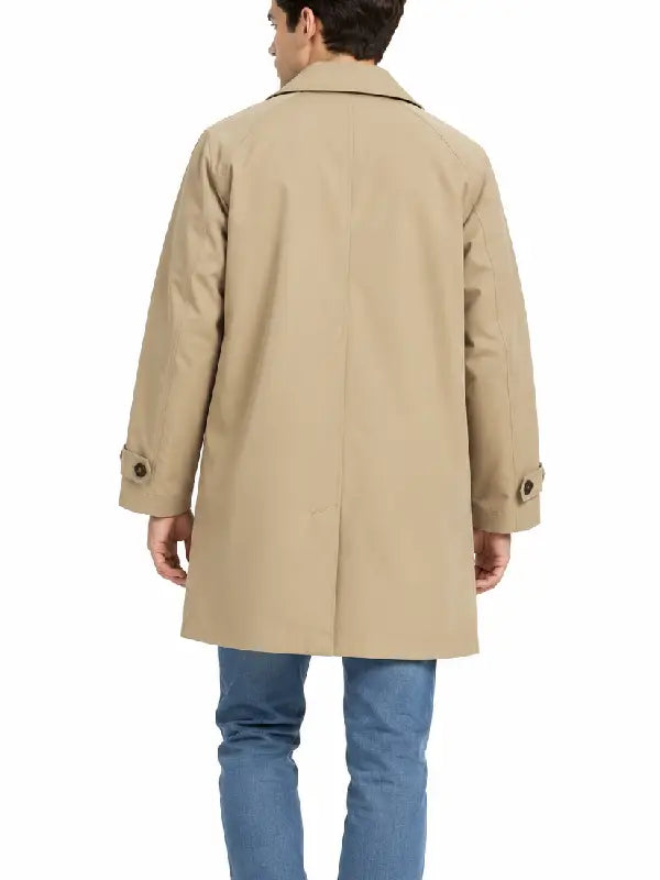 Back view of a men's beige car coat showing raglan sleeves and button tab cuffs