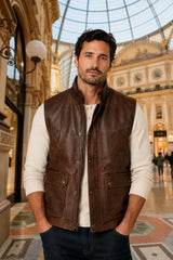 Men's brown leather vest with stand collar and multiple pockets front view