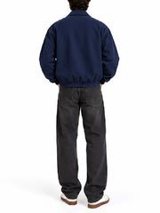 Men’s taupe faux suede bomber jacket back view with elasticated ribbed hem