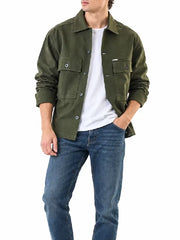 Front view of men’s olive green button-up overshirt jacket with chest flap pockets and shirt collar worn with blue jeans