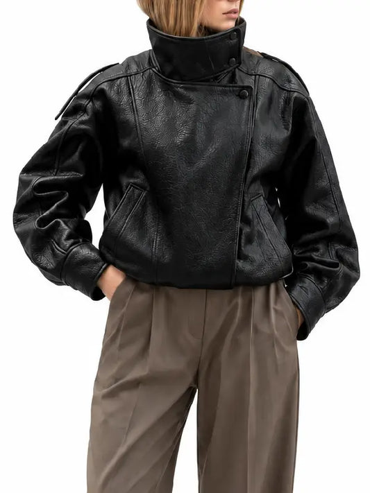 Front close-up of black real leather oversized biker jacket with high stand collar and asymmetric snap front
