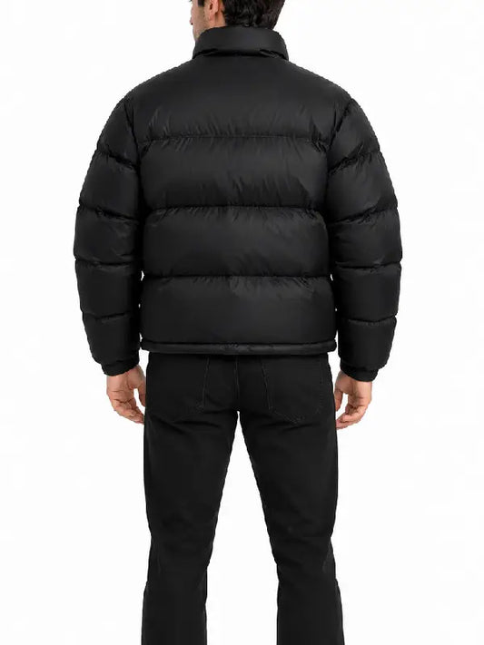 Back view of a men's black quilted puffer jacket with horizontal quilting and high stand collar