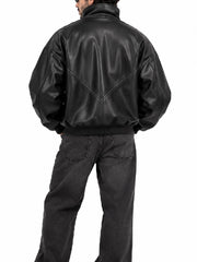 Back view of a men’s oversized black leather bomber jacket with V-shaped seam detail and ribbed hem