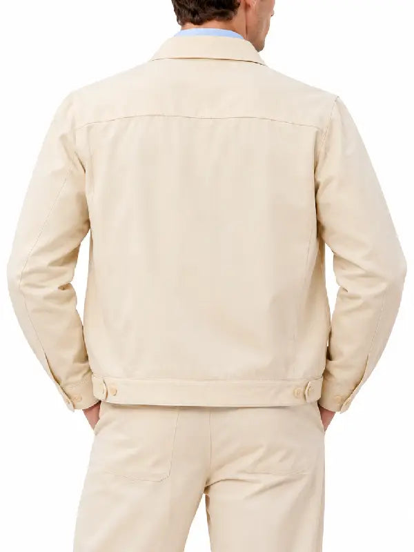 Back view of men's beige cotton trucker jacket with waist button tabs and shirt collar