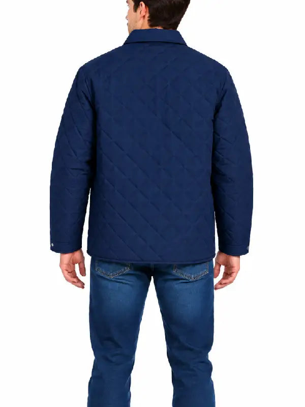 Man wearing navy diamond quilted shirt jacket, back view showing quilted stitching