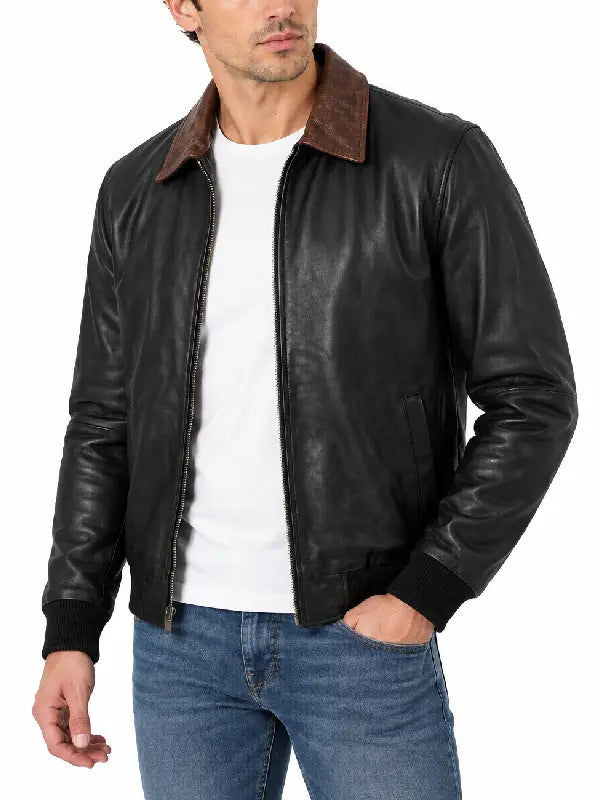 Side angle view of men's black leather bomber jacket with brown collar detail