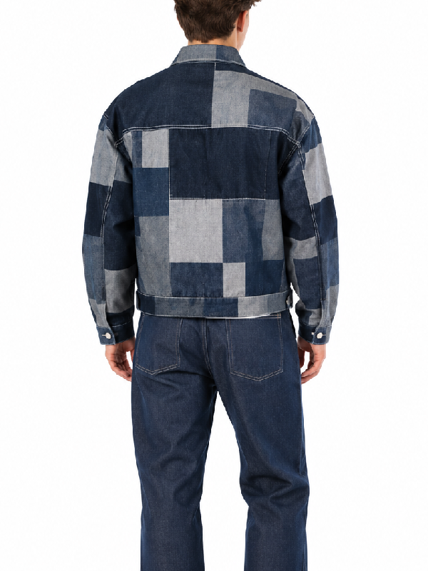 Back view of patchwork denim cropped jacket showing mixed denim wash paneling