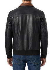 Back view of men's black leather jacket with brown contrast collar and ribbed hem