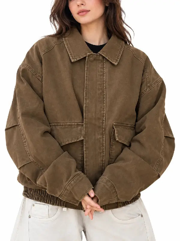 Front view of women's oversized brown washed cotton bomber jacket with flap pockets and shirt collar