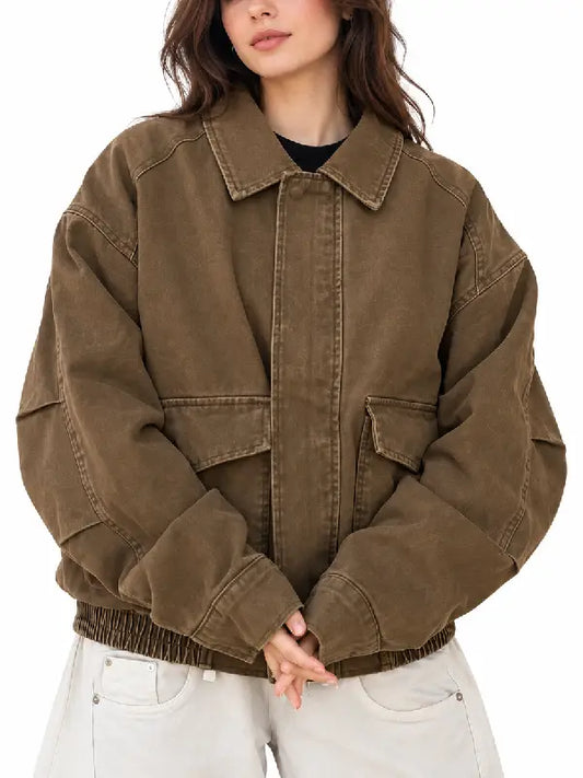 Front view of women's oversized brown washed cotton bomber jacket with flap pockets and shirt collar