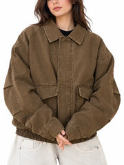 Front view of women's oversized brown washed cotton bomber jacket with flap pockets and shirt collar